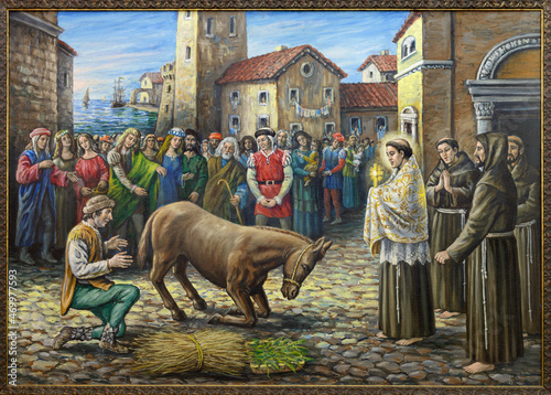 ROME, ITALY - SEPTEMBER 2, 2021: The painting of St Anthony and the Miracle of the Mule in the church Basilica di Sant'n Antonio al Laterano by author De Meo (1987).
