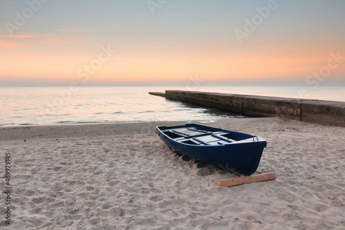 Single boat on the sea coast