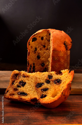 sliced ​​panettone on the table on neutral background