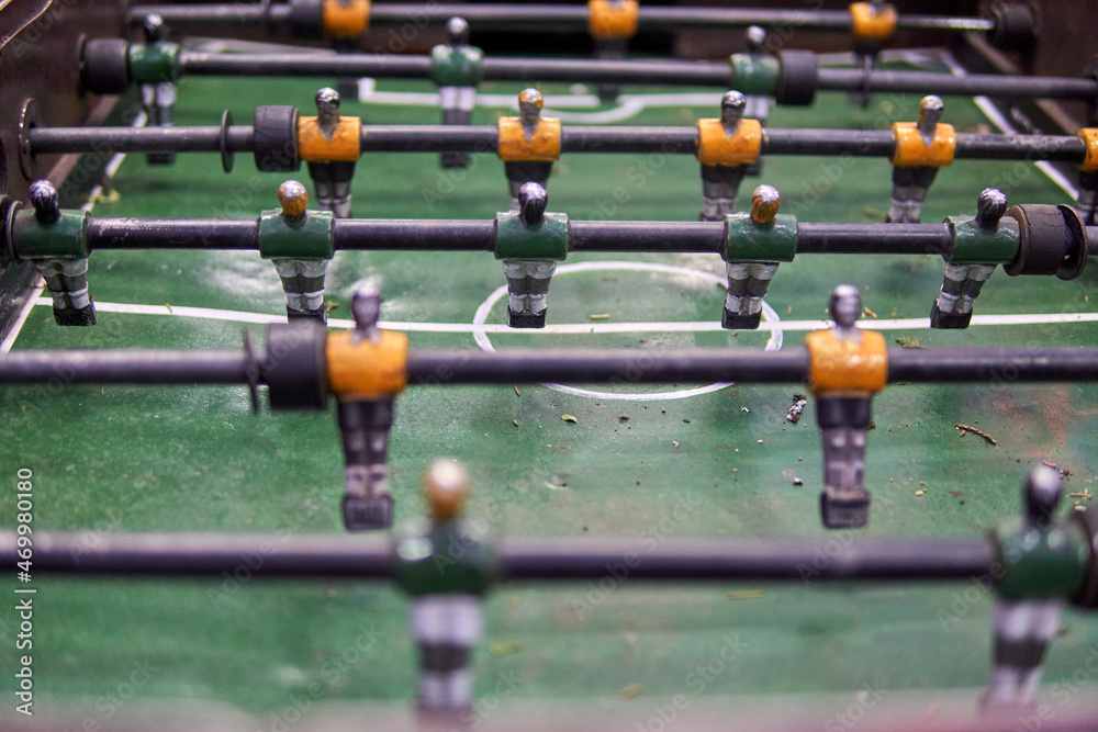 Close-up of Table football soccer game on green field. Horizontal