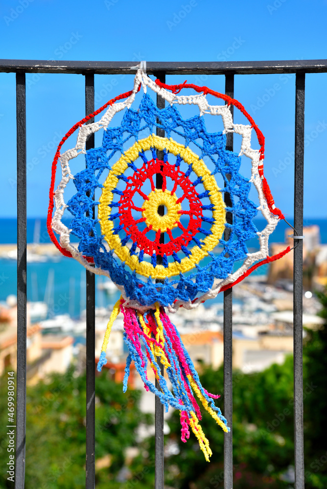 colored crochet lace as embellishment and street furniture in the historic center of castellammare del golfo italy