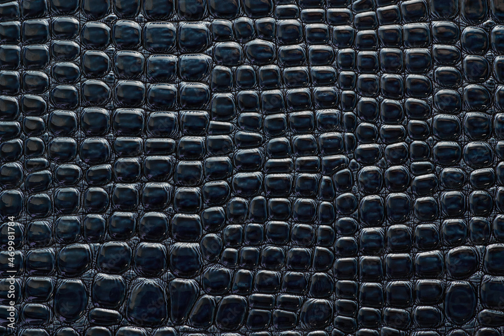 Fototapeta premium blue crocodile artificial leather with waves and folds on PVC base