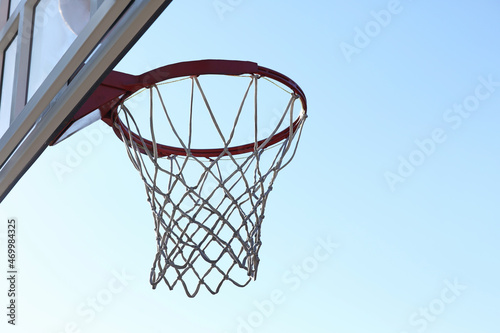 Basketball hoop with net outdoors on sunny day © New Africa