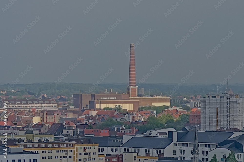 Aerial view of Rabot neighborhood in Ghent, Belgium, with modern apartment blocks, old brick stone industrial buildings and chimney 