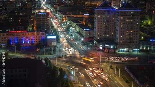 Timelapse view of night traffic on major intersection in central Ulan Bator, the capital and largest city of Mongolia.  photo