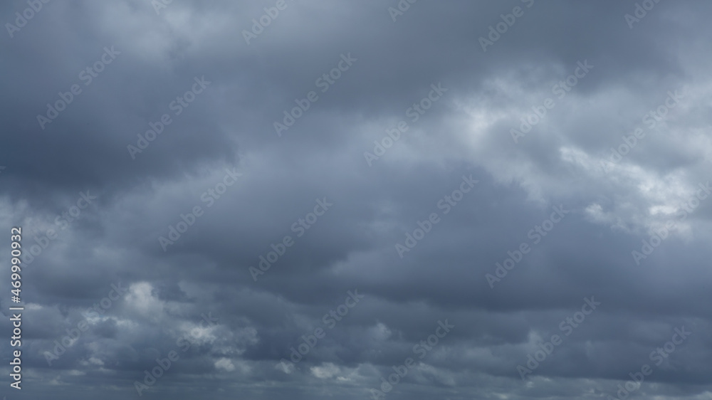 Dark storm clouds make the sky in black. Rain is coming soon. Nature background.