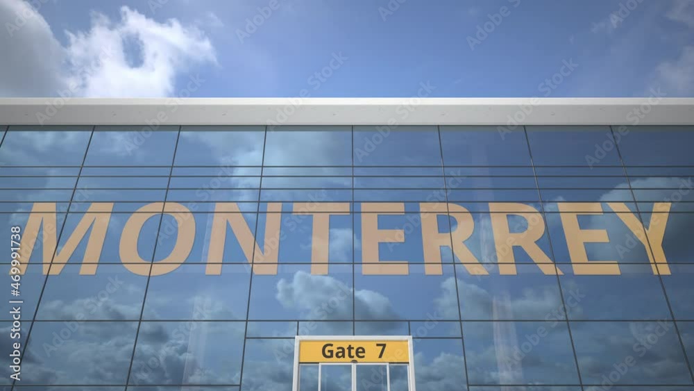 Plane reflects in the airport terminal with MONTERREY city name
