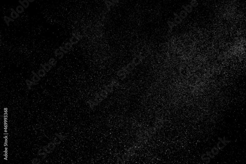 Distressed white grainy texture. Dust overlay textured. Grain noise particles. Snow effects pack. Rusted black background. Vector illustration, EPS 10.  