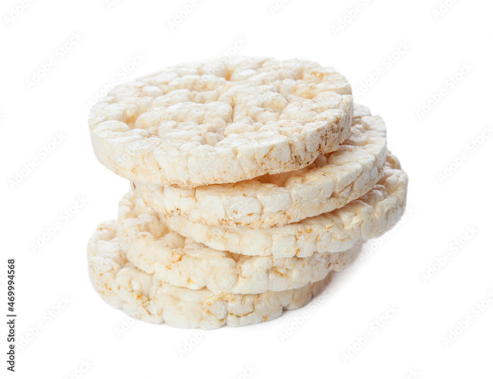 Stack of puffed rice cakes isolated on white background. Healthy crunchy snack. Wholegrain crisp bread Stack of puffed rice cakes isolated on white background. Healthy crunchy snack. Wholegrain crisp bread