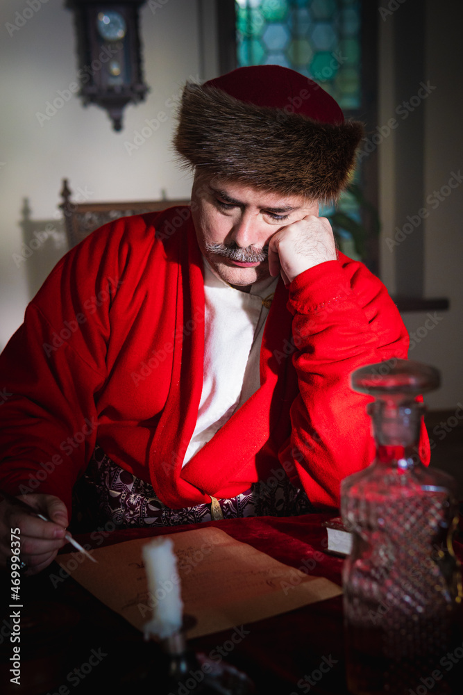 Portrait of a man in a medieval costume. Retro style and historical clothes concepts. Ukrainian Men's fashion of the 18th century Portrait of a man in a medieval costume. Retro style and historical clothes concepts. Ukrainian Men's fashion of the 18th century