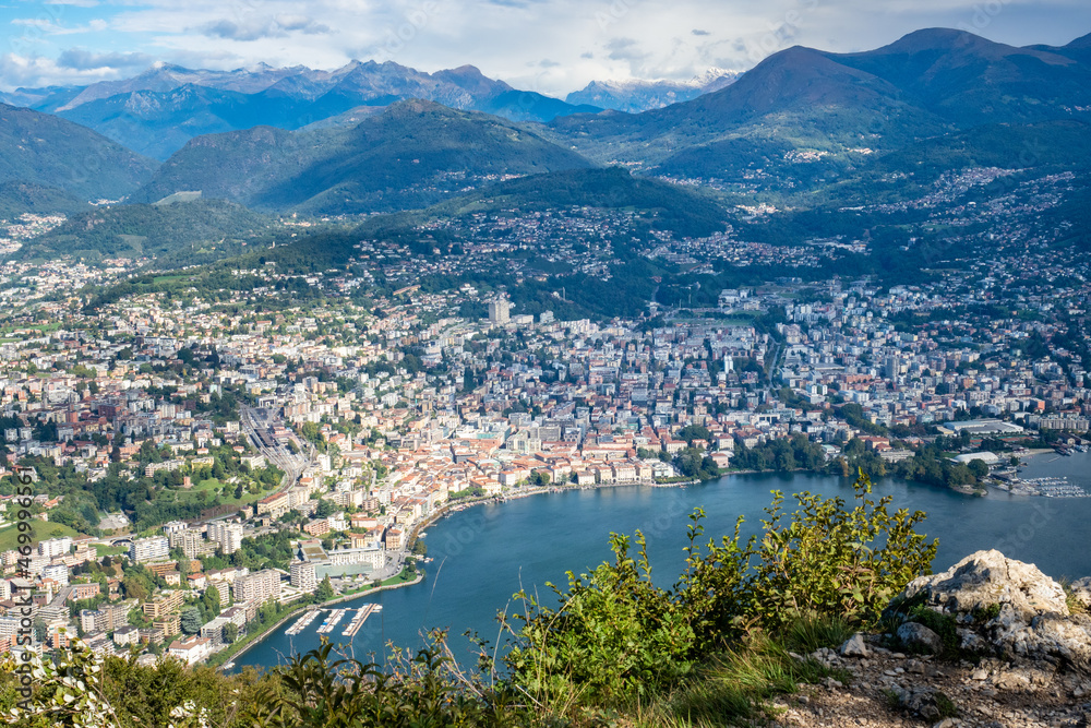 Lugano, Switzerland - October 6th 2021: View from Monte San Salvatore towards the city surrounded by mountains