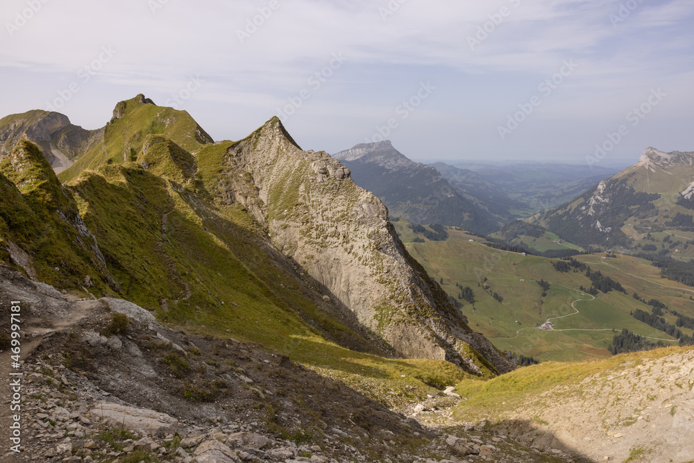 Fototapeta premium Amazing hiking day in the alps of Switzerland. Wonderful view over a beautiful lake called Brienzersee. What an amazing view.