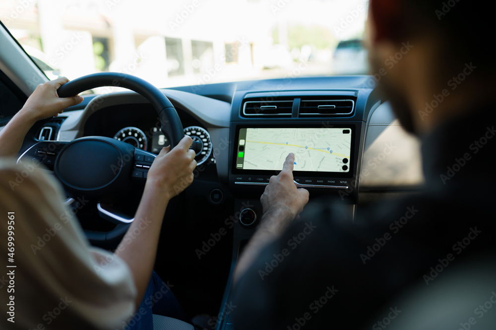 Rear view of a person using the navigation system Rear view of a person using the navigation system