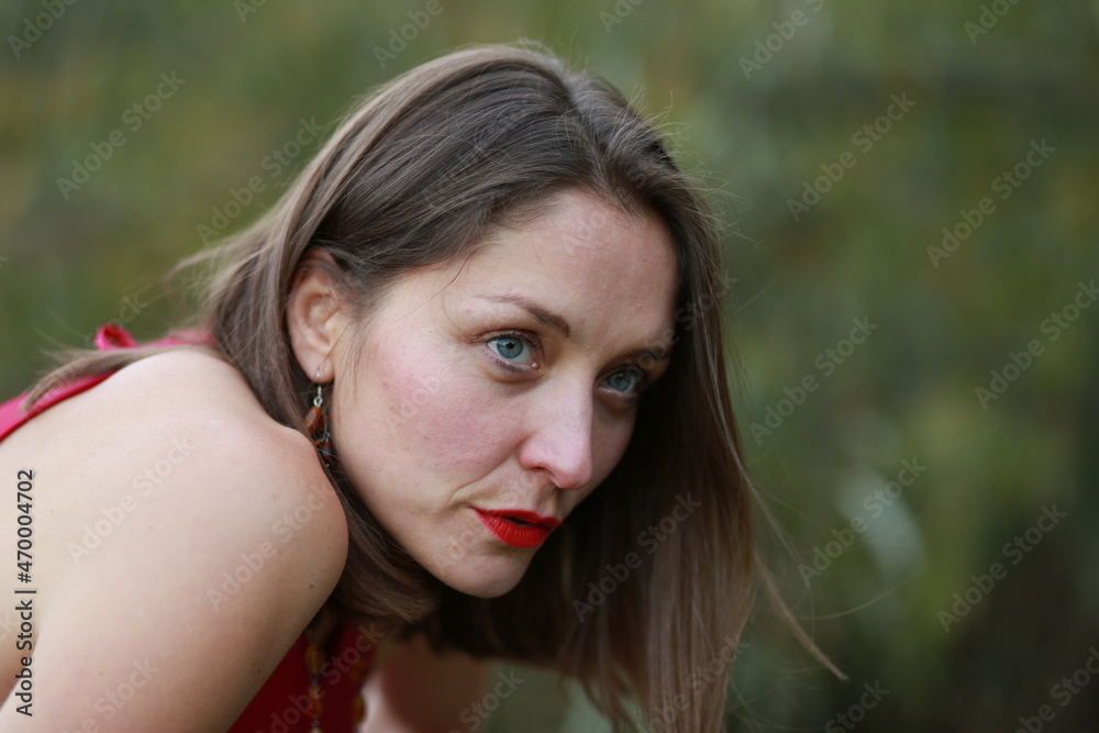 Outside portrait of a woman in red dress