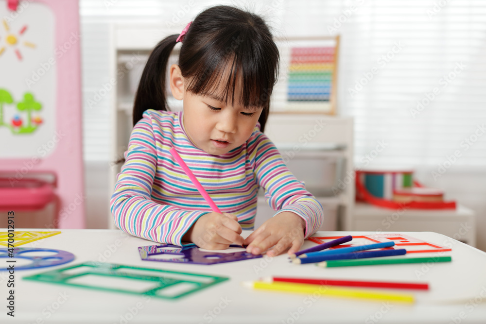 young girl drawing different shapes for homeschooling young girl drawing different shapes for homeschooling