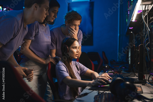 E sports team gathered together in the computer club and watching the stream