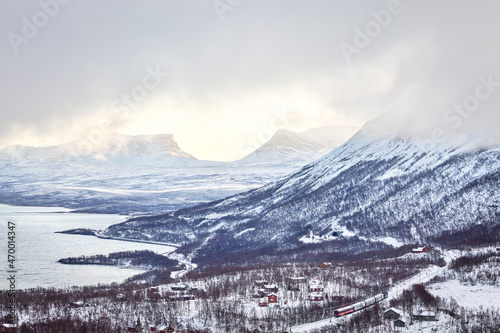 Vinter wiev towards Abisko with lapporten valley and Torneträsk lake, famous sights of the Swedish Lapland seen from Björkliden montains top.