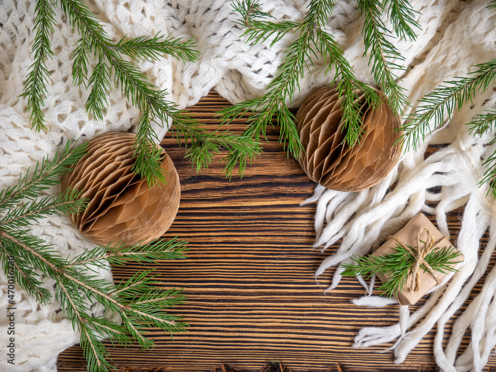 Obraz premium Christmas background. Handmade Christmas balls, a warm scarf, christmas tree. Zero waste