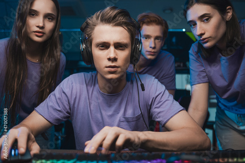 Fotografie Gamers playing in first-person shooter online video game on personal computer