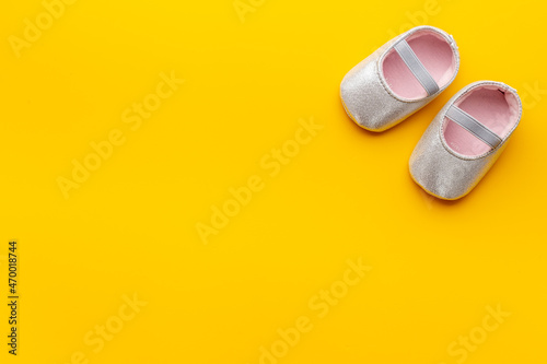 Baby girl pink newborn booties - child birth background
