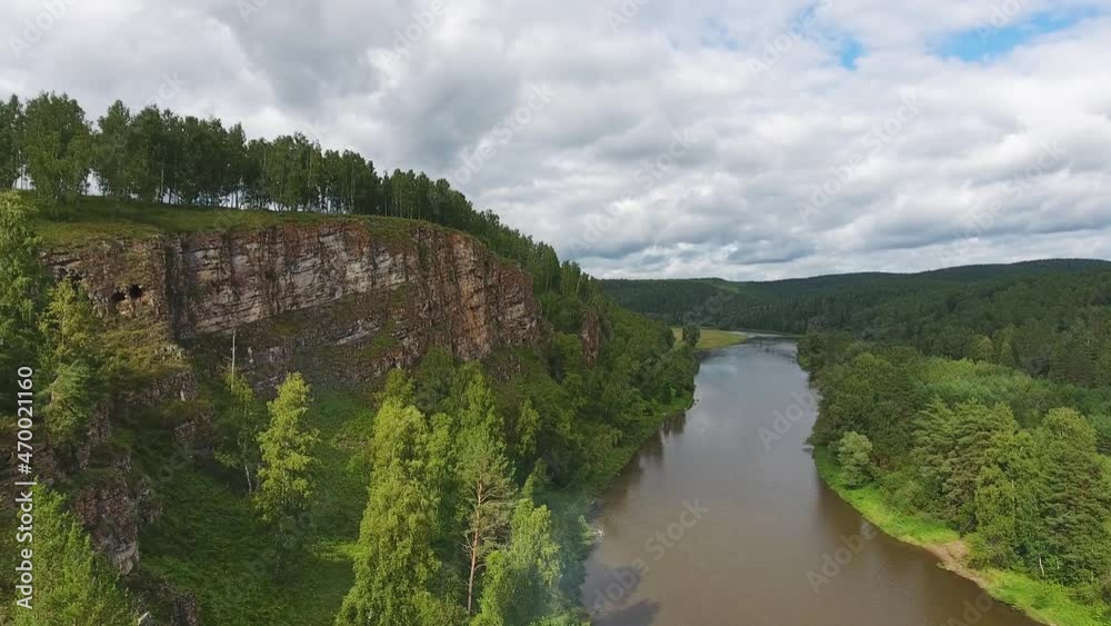 Aerial landscape with Yuruzan river and cave in rock in Ural mountains, Russia,  4k