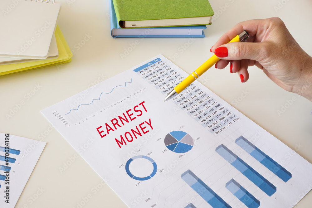 EARNEST MONEY sign on the piece of paper. EARNEST MONEY sign on the piece of paper.