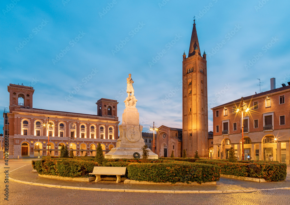 Forlí - The piazza Aurelio Saffi square with the his memorial and Basilica San Mercuriale at dusk.