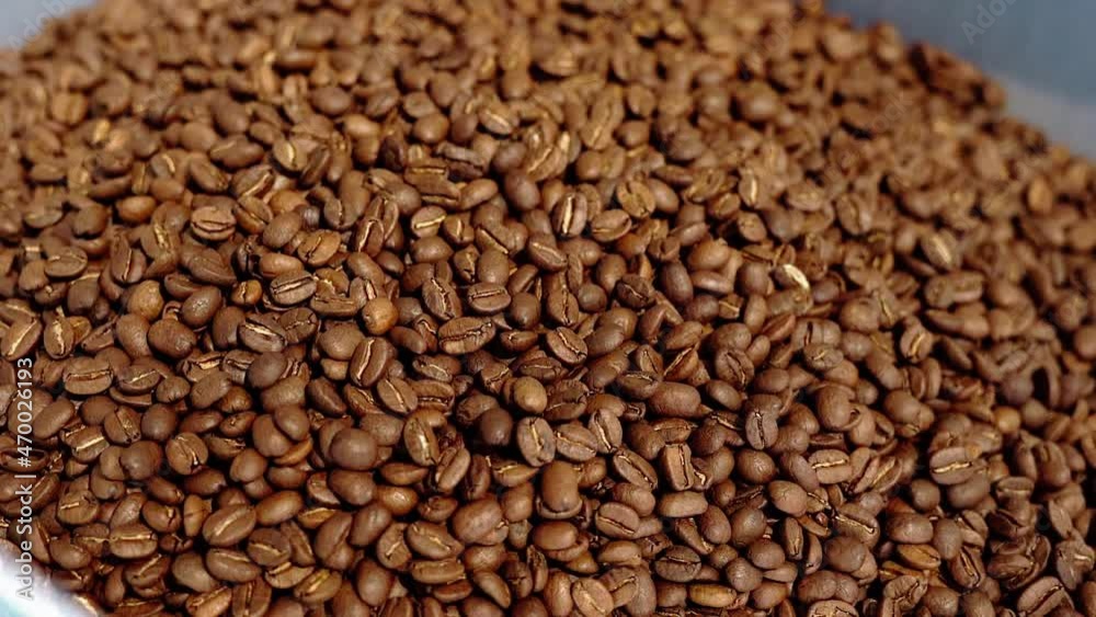 Roasted Coffee Beans Group Falling Down. Concept of making delicious aromatic drink Roasted Coffee Beans Group Falling Down. Concept of making delicious aromatic drink