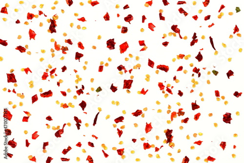 crushed red chili pepper or red chilli pepper in white background as food related concept