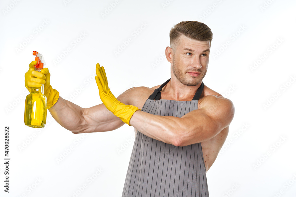 cheerful man in apron detergent posing muscles cheerful man in apron detergent posing muscles