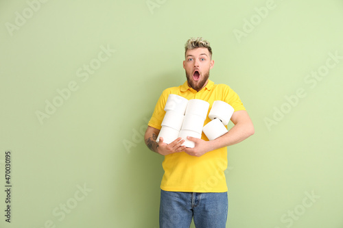 Shocked young man with many...