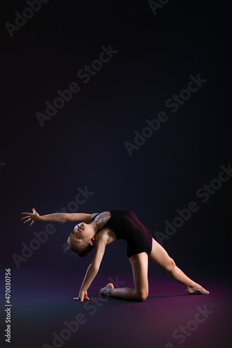 Little girl doing gymnastic...