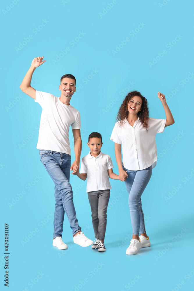 Happy interracial family on color background