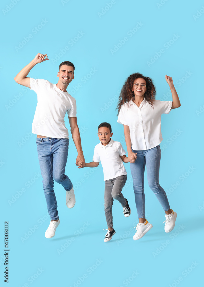 Happy dancing interracial family on color background Happy dancing interracial family on color background