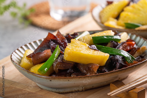 Stir-fried pineapple with black wood ear fungus.