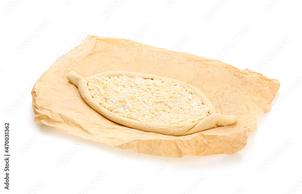 Homemade Ajarian khachapuri preparing for baking on white background Homemade Ajarian khachapuri preparing for baking on white background