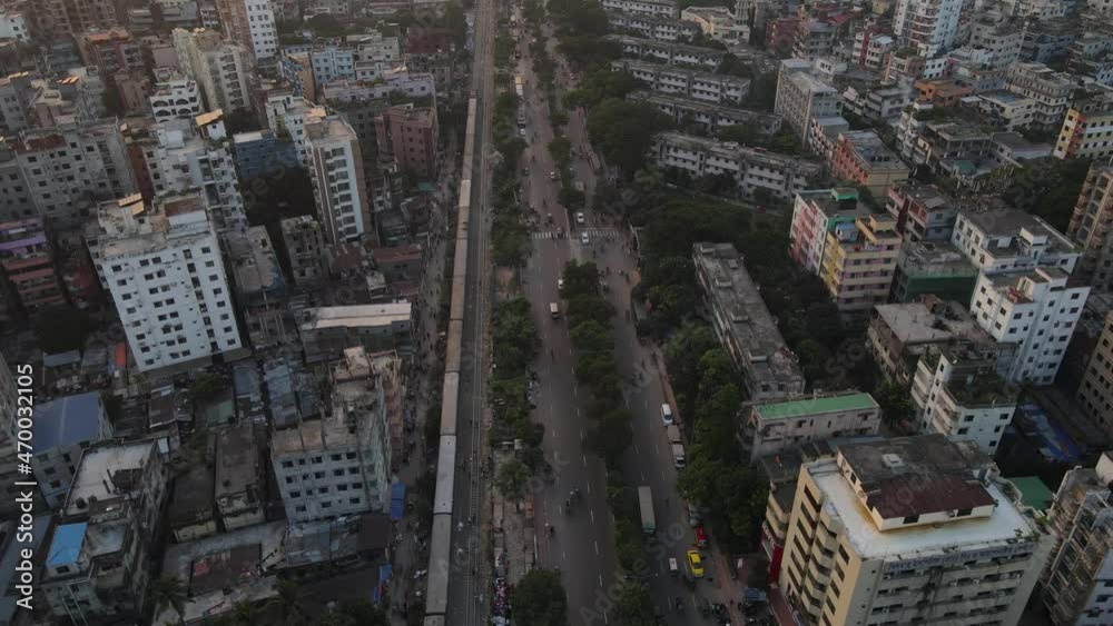 Drone flight shows train and traffic flow along highway in Dhaka city, Bangladesh Drone flight shows train and traffic flow along highway in Dhaka city, Bangladesh