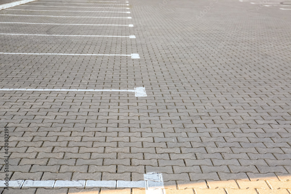 Fototapeta premium Empty parking lot with white marking lines