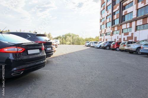 Cars parked in parking lot outdoor © Pixel-Shot