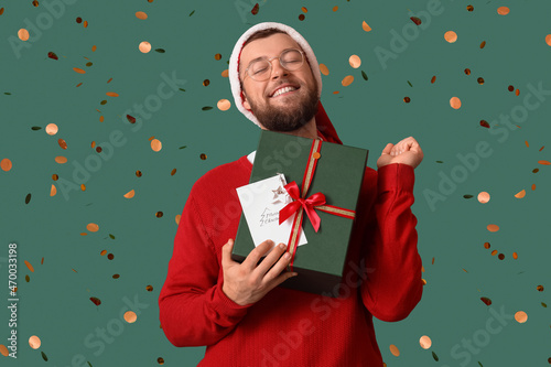 Happy man with Christmas gi...