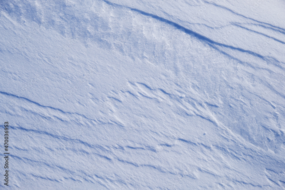 Texture of winter snow surface. Blue natural snow background. Texture of winter snow surface. Blue natural snow background.