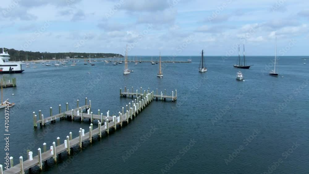 Sailboats Anchored Near The Jetty In Vineyard Heaven Pier In Cape Cod, Ma, USA. wide shot
