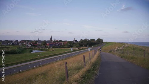 Handheld unstable shaky footage of man walking on highway along the beach.