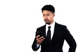 A young businessman in a black suit takes mobile messaging in corporate chats seriously. Empty space for text. White background.