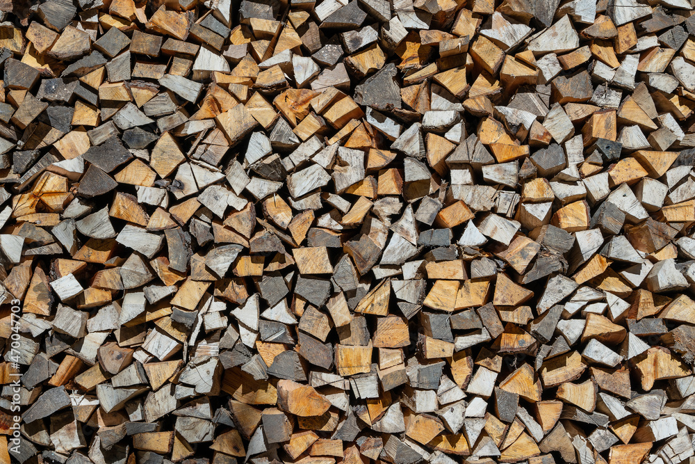 Stack of firewood, wooden abstract background, close up