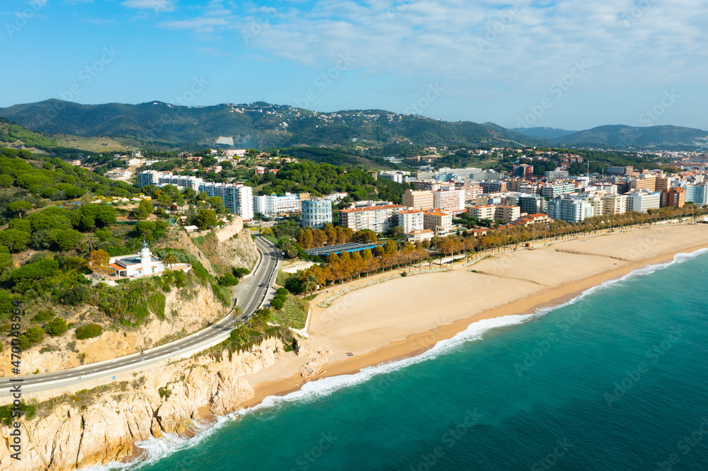 Aerial photo of Spanish town Calella with view of beach and residential buildings.