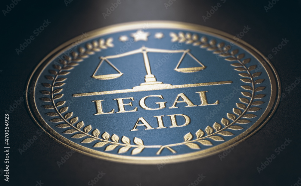Legal aid written with golden letters over blue and black background. Law concept. 3D