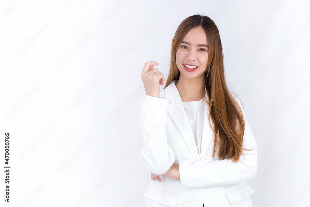 Young Asian beautiful woman who has blond long hair wears white suit and arm crossing while stands with white background. Young Asian beautiful woman who has blond long hair wears white suit and arm crossing while stands with white background.