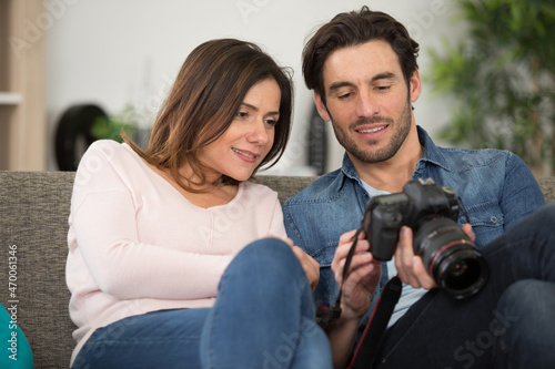 photographer and his wife man hold dslr camer