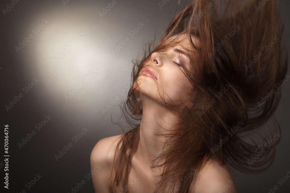 Sensual young woman with beautiful long brown hairs, posing. Studio shot Sensual young woman with beautiful long brown hairs, posing. Studio shot